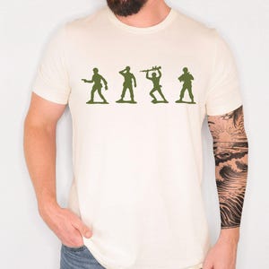 May include: A white ceramic mug with a black handle and the text "But First, Coffee" in a handwritten style. The mug is likely 325 ml and suitable for hot drinks.