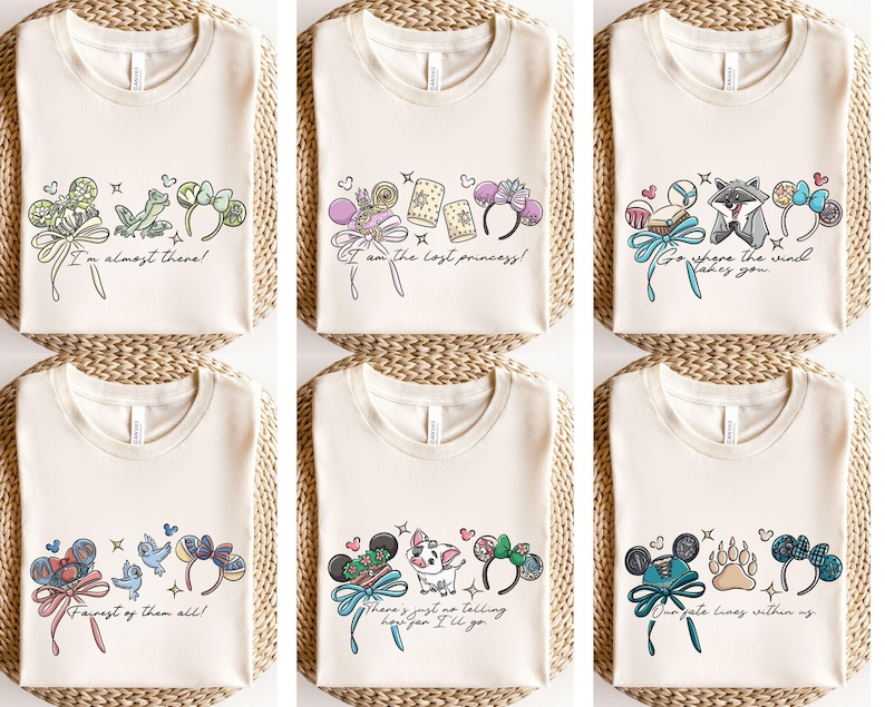 Puede incluir: Camisetas de color crema con varios dise&ntilde;os gr&aacute;ficos coloridos. Cada camiseta presenta un dise&ntilde;o diferente, que incluye texto e ilustraciones de personajes, lazos y diademas. El texto de las camisetas incluye frases como "I'm almost there!" y "Our fate lies within us."