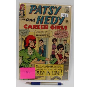 May include: A vintage comic book cover featuring Patsy and Hedy, two young women, in a career setting. The cover is yellowed with age and has the title "Patsy and Hedy Career Girls" and the text "Patsy in Love!"