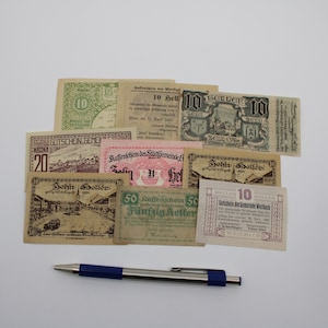 May include: A collection of vintage German paper money, including a 10 Heller note, a 10 Seller note, a 20 Seller note, a 50 Seller note, and a 10 Heller note. The notes are in various shades of brown, green, and pink.