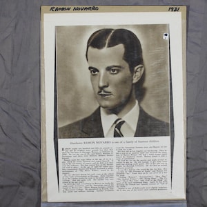 May include: A black and white photo of Ramon Novarro, a handsome actor, from 1931. The photo is from a magazine and includes a short biography of the actor.