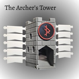 May include: A gray 3D-printed model of a castle tower with the text "The Archer's Tower". The tower has a circular emblem with a red border and a symbol. White, flag-shaped pieces extend from the sides.