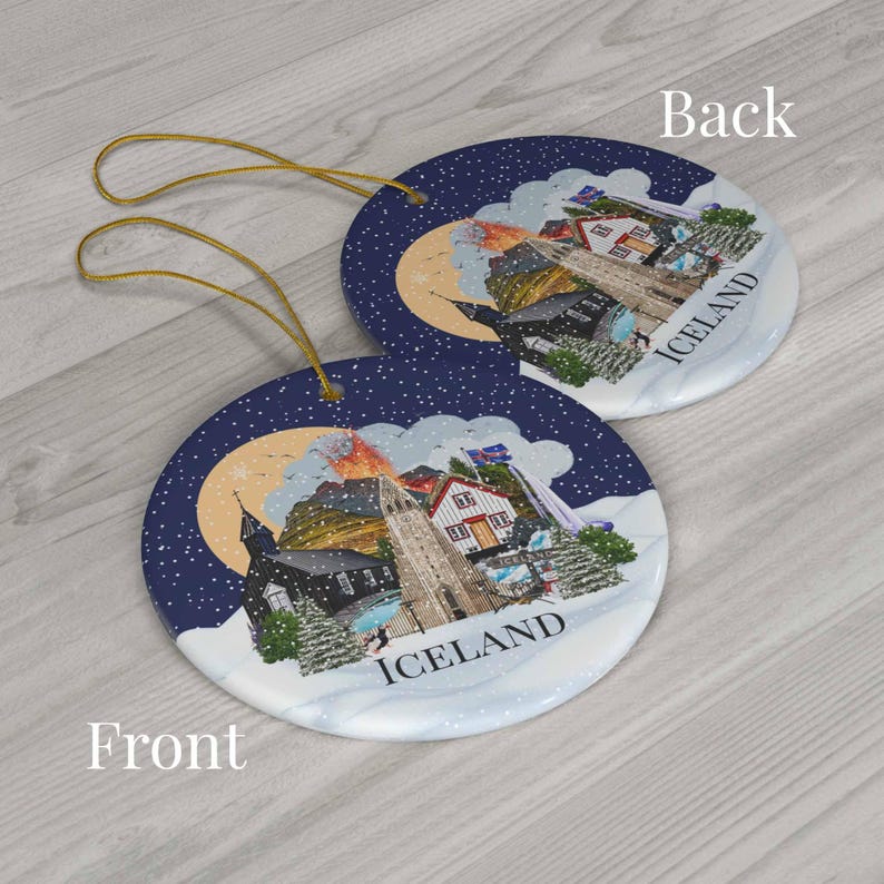Colourful double sided Iceland ornament with a blue background and white snow. The baubles feature a colourful illustration of popular Icelandic Landmarks like the Reykjavik church, waterfall, volcano, black sand beach, elephant rock, puffins and more! The text "ICELAND" is printed on under the design.