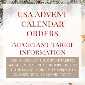 May include: A white informational sign with red text reading USA ADVENT CALENDAR ORDERS IMPORTANT TARIFF INFORMATION. A tan rectangular box at the bottom contains white text stating DUE TO CURRENT U.S. IMPORT TARIFFS, ALL ADVENT CALENDAR ORDERS SHIPPING TO THE USA ARE CURRENTLY SUBJECT TO AN ADDITIONAL U.S. IMPORT TARIFF.