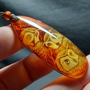 Amber pendant Owls