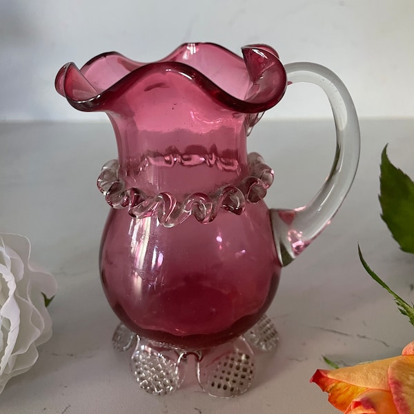 A Rare Pretty Antique Cranberry Glass Cream Jug With applied Crystal Frill & Feet