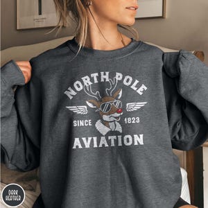 North Pole Aviation Sweatshirt, Reindeer Aviation sweatshirt, Winter Cozy sweater, Snow outfit, holiday gift, Christmas apparel, Winter Wear