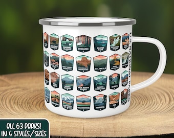May include: White enamel camping mug with a silver rim and handle. The mug features a design of all 63 US National Parks, each with a unique illustration and name. The text "ALL 63 PARKS! IN 4 STYLES/SIZES CAMPING MUG SHOWN HERE" is printed below the design.