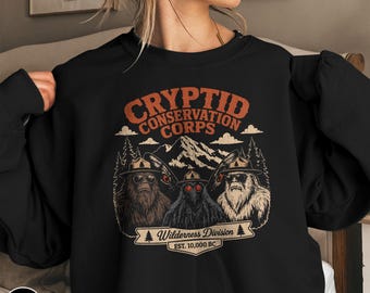 Cryptid Conservation Corp Sweatshirt Sasquatch Bigfoot Wilderness Adventure Gift National Park Lover Forest Explorer Outdoor Nature Crewneck