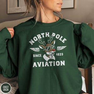 North Pole Aviation Sweatshirt, Reindeer Aviation sweatshirt, Winter Cozy sweater, Snow outfit, holiday gift, Christmas apparel, Winter Wear