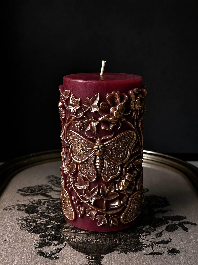 burgundy gothic candle with gold details witchy home decor