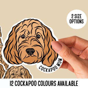 May include: A sticker with a Cockapoo dog illustration, showcasing a brown coat and black outline. The sticker reads "Cockapoo Mum" and is available in 12 colours. The image also includes the text "2 Size Options".