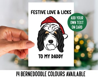 Może przedstawiać: Kartka świąteczna z kreskówkowym psem rasy Bernedoodle w czapce Świętego Mikołaja. Na kartce napisano "Festive Love & Licks to my Daddy" i "Add your own text on card".