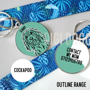 May include: Two round dog tags with a blue and white patterned strap. The first tag has a black and white illustration of a dog with the name "Sunny" and the word "Cockapoo". The second tag has the text "Contact My Mom" and a phone number.