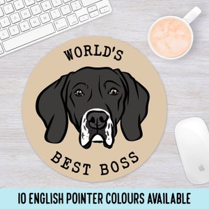 May include: A round mouse mat with a tan background featuring a black and white English Pointer dog with the text "WORLD'S BEST BOSS" printed on it.