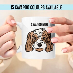 May include: White ceramic mug with a brown and white cartoon Cavapoo dog and the text "Cavapoo Mum" printed on it.