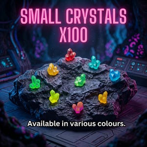 May include: A collection of small, translucent, multi-colored crystals arranged on a dark, textured rock surface. The text "SMALL CRYSTALS X100" appears at the top, and the text "Available in various colours." is printed at the bottom.