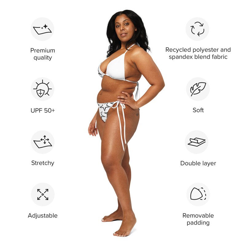 May include: White bikini with black star print. The bikini top has adjustable straps and the bottom has adjustable ties. The bikini is made from recycled polyester and spandex blend fabric. It is soft, stretchy, and has a double layer. The bikini also has removable padding.