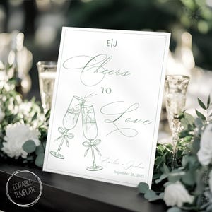 Plantilla de letrero de brindis con champán para bodas en color verde salvia, dibujada a mano y editable, para hacer tú mismo - CE1
