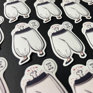 Puede incluir: Un conjunto de pegatinas de dibujos animados blancas y negras con el texto "NAH, I'D WIN." impreso en cada pegatina. Las pegatinas representan a un personaje de dibujos animados con pantalones blancos y una salpicadura roja en la espalda.