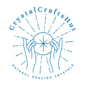 May include: A blue and white logo for Crystal Crafts Hut. The logo features two hands holding a crystal ball with a starburst design. The text "Crystal Crafts Hut" arches above the ball, and "Natural Healing Crystals" is below.