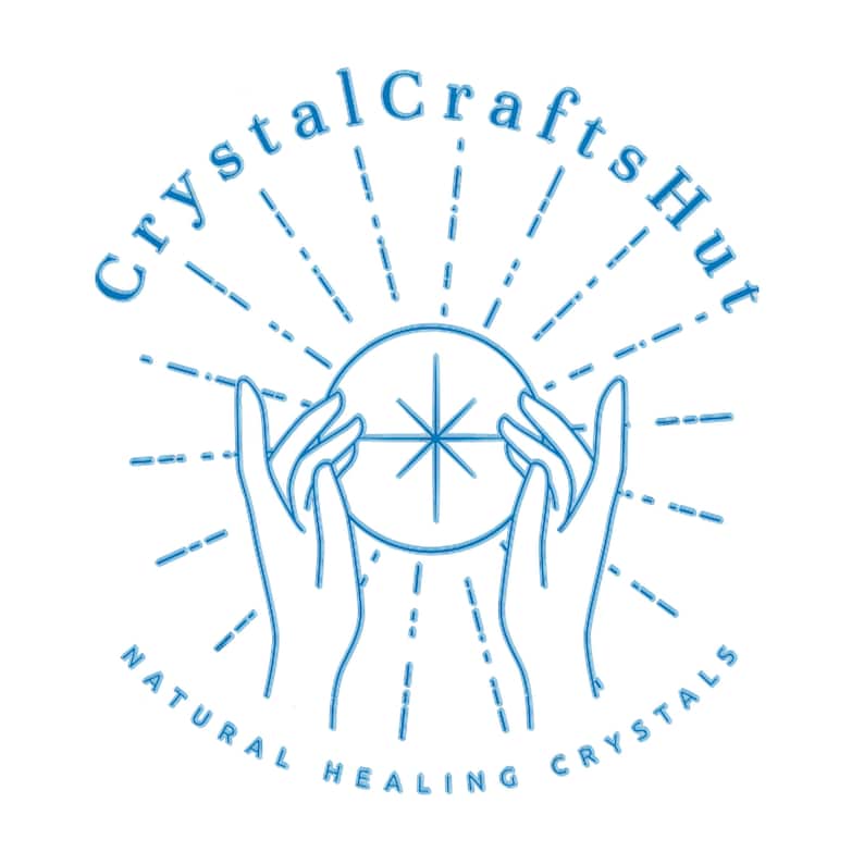 May include: A blue and white logo for Crystal Crafts Hut. The logo features two hands holding a crystal ball with a starburst design. The text "Crystal Crafts Hut" arches above the ball, and "Natural Healing Crystals" is below.