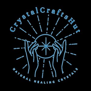 May include: A blue line drawing of two hands holding a crystal ball with a star inside. The text "Crystal Crafts Hut" is above the hands and "NATURAL HEALING CRYSTALS" is below the hands.