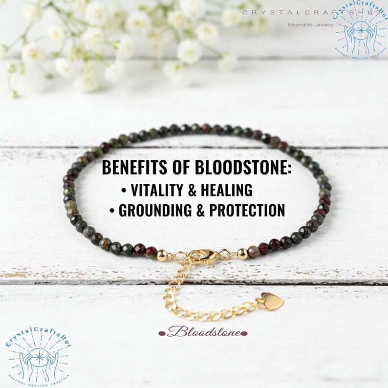 May include: A beaded bloodstone bracelet with a gold-colored clasp and extender chain. The bracelet is composed of small, dark green and red beads. Text on the image reads "Benefits of Bloodstone: Vitality & Healing, Grounding & Protection."