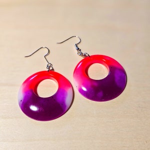 Neon pink, purple, and white epoxy resin dangle earrings