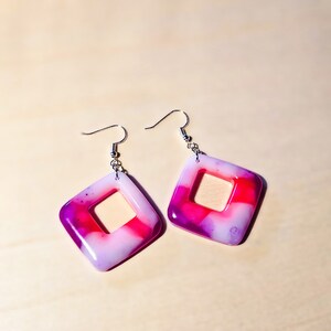 Neon pink, purple, and white epoxy resin dangle earrings