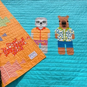 Crockett and Tubbs quilt-Animal Animal fabrics-Features a Capybara and Sloth on the back - 57” x 82”size- Ready to ship