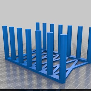 May include: A blue plastic storage rack with a grid pattern. The rack is designed to hold multiple items upright.