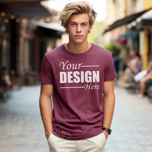 May include: A maroon t-shirt with short sleeves and a white print that says "Your Design Here".
