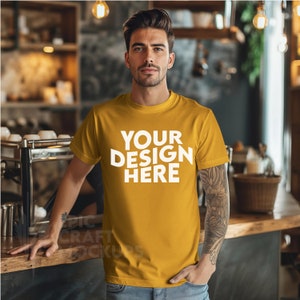 Mustard Bella Canvas 3001 Mockup Tshirt Man Indoors Coffee Shop Cozy Styled Male Mock Up, POD Model Men T-Shirt Mockup Tee