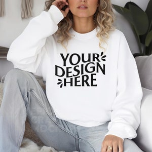 May include: White sweatshirt with the text "YOUR DESIGN HERE" printed on the front.