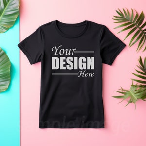 May include: Black t-shirt with the text "Your DESIGN Here" printed in white on the front.