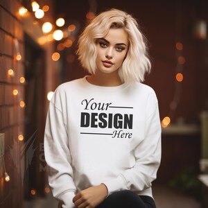 Gildan 18000 Mockup White Blonde Woman Model Indoors Cozy Lights, Gildan Oversized Crewneck Mockups, Casual Wear Mockup Clothing Mockup