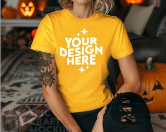 May include: A yellow t-shirt with short sleeves and a crew neck. The shirt has the text "YOUR DESIGN HERE" printed on the front in white with small white stars.