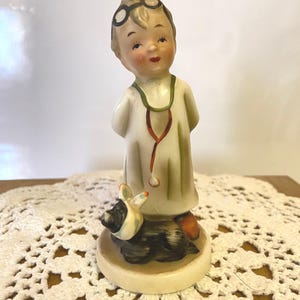 Vintage NAPCO "Little Vet" and Watchdog Figurine" stands 4 /14" and is made in Japan