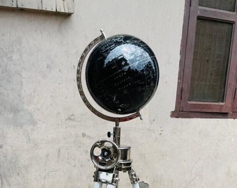 Black world globe with white tripod stand