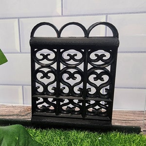 May include: Black metal decorative fence with a heart-shaped design. The fence is made of metal and has a black finish.