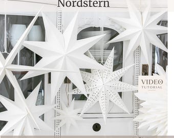 Peut inclure: Une collection d'étoiles décoratives en papier blanc de différentes tailles et motifs, certaines avec des perforations. Le texte indique Digital Cutting Files Nordstern et VIDEO TUTORIAL SVG/STUDIO3/DXF/PDF. Ce sont des étoiles suspendues.