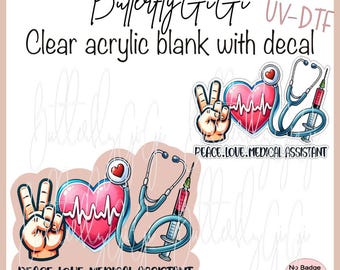 May include: A clear acrylic blank with a decal featuring a peace sign, a heart with a heartbeat line, a stethoscope, and a syringe. The decal has the text "Peace. Love. Medical Assistant".