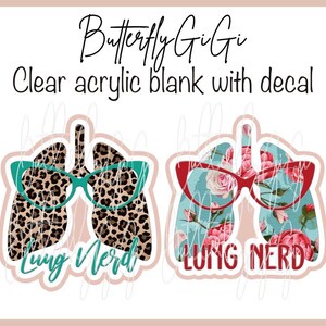 May include: Clear acrylic blanks with decals featuring lung designs. One has a leopard print pattern with teal glasses and the text "Lung Nerd." The other has a floral pattern with red glasses and the text "Lung Nerd."