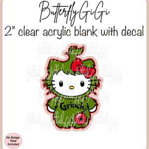 May include: A 2 inch clear acrylic blank with a decal of Hello Kitty dressed as the Grinch. The decal is green with a red bow and the word "Grinch" written on it.
