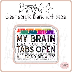 May include: A white sticker with a colorful design of file folders at the top. The text on the sticker reads "My brain has too many tabs open. 4 of them are frozen & I have no idea where the music is coming from."
