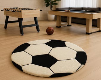 Alfombra de lana tejida a mano con forma de balón de fútbol, con diseño geométrico en blanco y negro para habitación infantil.