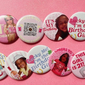 May include: A collection of pink and white round buttons with various designs and text. Some buttons feature photos of a young person, while others have phrases like "I'm 21 & Hot" and "It's My Birthday."