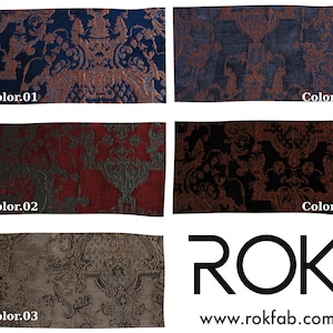 May include: A collection of fabric swatches in various colors, including navy blue, charcoal, red, black, and taupe. Each swatch features an ornate, damask-style pattern in contrasting metallic tones. The swatches are labeled with color codes.