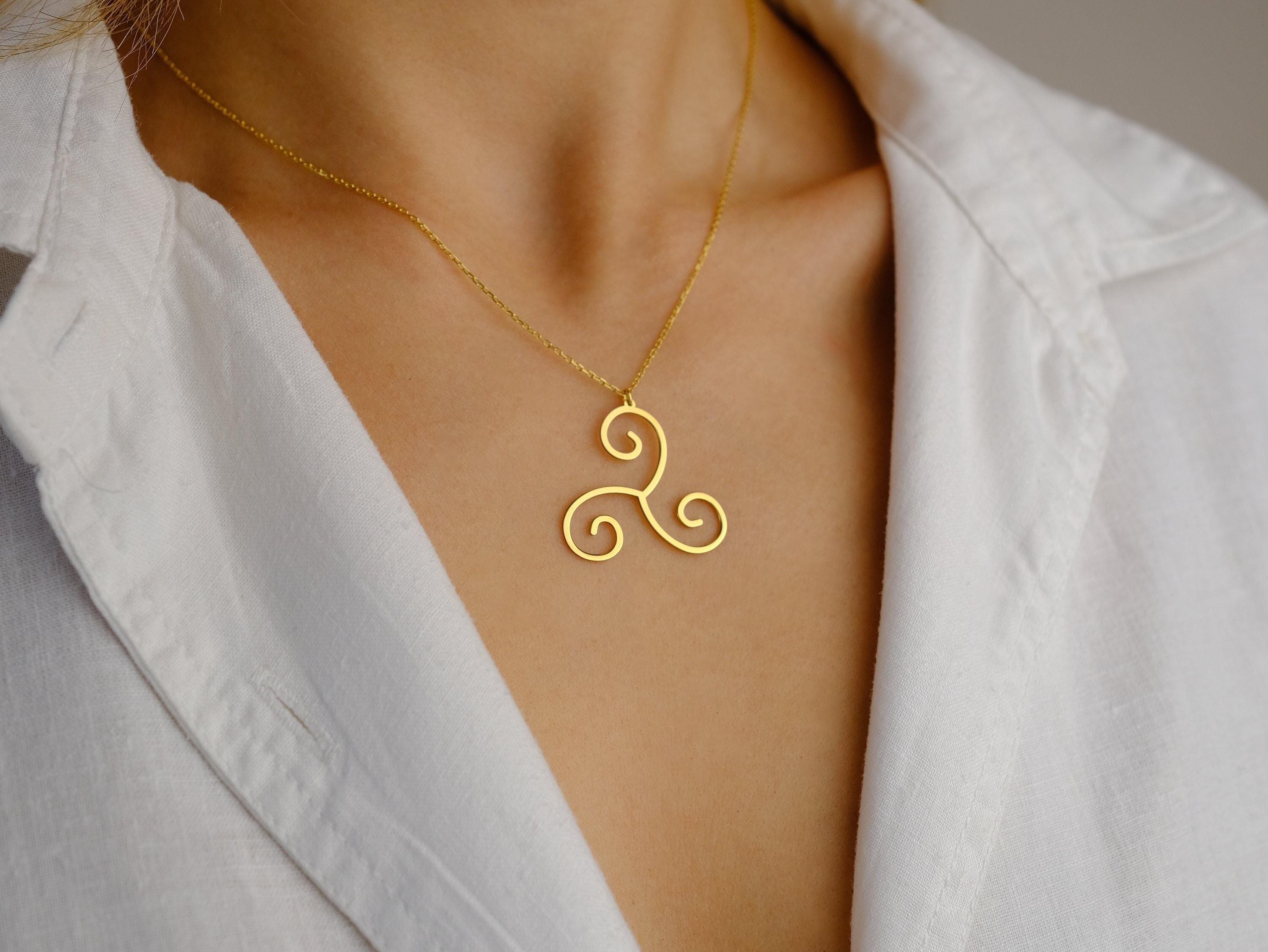 Gold triskele pendant new arrivals